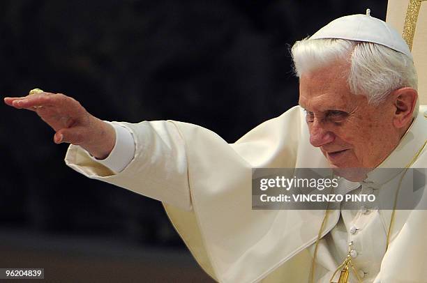 Pope Benedict XVI waves during his weekly general audience on January 27, 2010 at the Paul VI hall at The Vatican. AFP PHOTO / VINCENZO PINTO