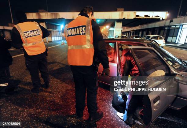 Lille's French customs officers check the load of a vehicle on February 3, 2011 at the Rekkem Franco-Belgian border checkpoint in...