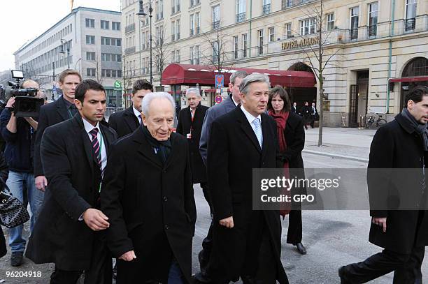 In this handout image supplied by the Israeli Government Press Office , Israeli President Shimon Peres visits the Brandenburg Gate with Berlin Mayor...