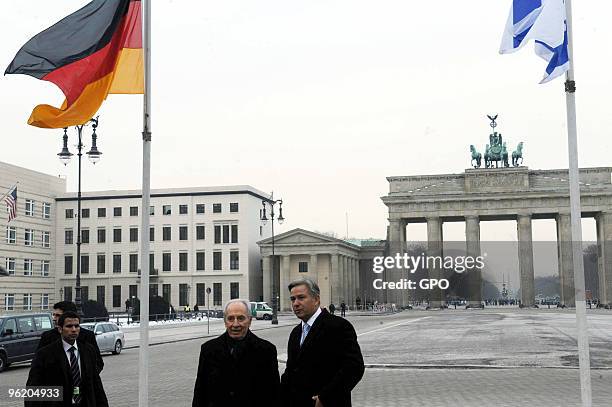 In this handout image supplied by the Israeli Government Press Office , Israeli President Shimon Peres visits the Brandenburg Gate with Berlin Mayor...