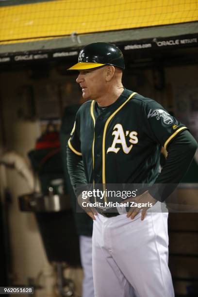 Third Base Coach Matt Williams of the Oakland Athletics stands in the dugout during the game against the Houston Astros at the Oakland Alameda...