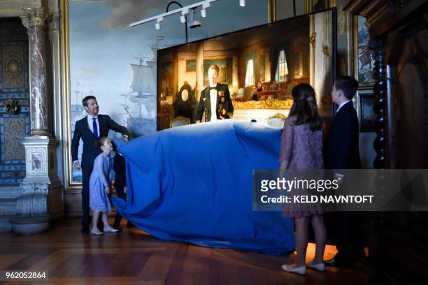 Crown Prince Frederik of Denmark , with his children, unveils a portrait of him by Australian artist Ralph Heimans on May 24, 2018 at Frederiksborg...