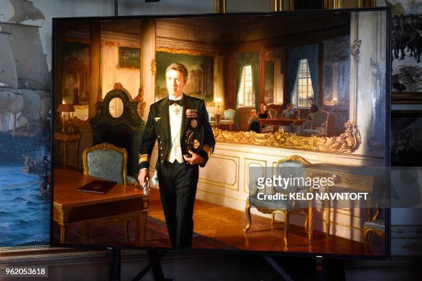 Picture taken on May 24, 2018 shows a portrait of Crown Prince Frederik of Denmark by Australian artist Ralph Heimans during its unveiling at...