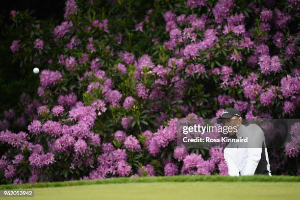 Matt Fitzpatrick of England plays his third shot on the 16th hole during the first round of the BMW PGA Championship at Wentworth on May 24, 2018 in...