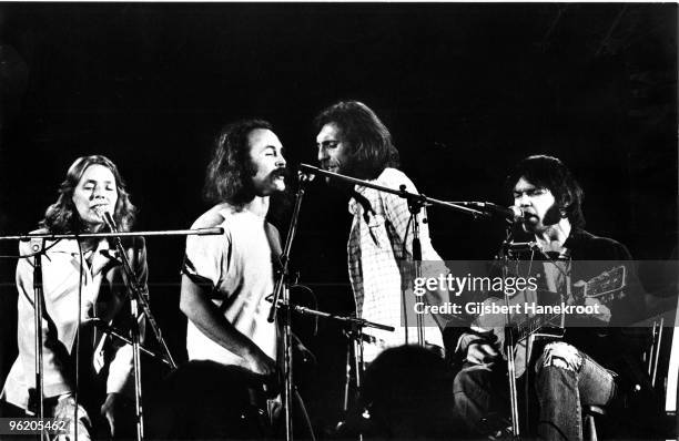 Crosby, Stills, Nash & Young perform live on stage at Wembley Stadium on September 14 1974 L-R Joni Mitchell, David Crosby, Graham Nash, Neil Young