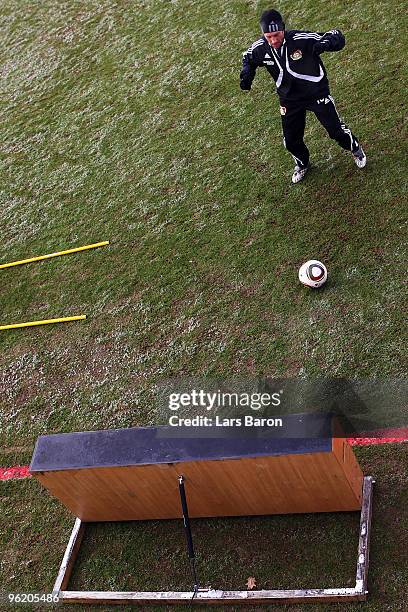Injured player Thomas Zdebel kicks a ball during a Bayer 04 Leverkusen training session on January 27, 2010 in Leverkusen, Germany.