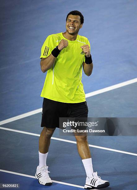 Jo-Wilfried Tsonga of France celebrates winning his quarterfinal match against Novak Djokovic of Serbia during day ten of the 2010 Australian Open at...