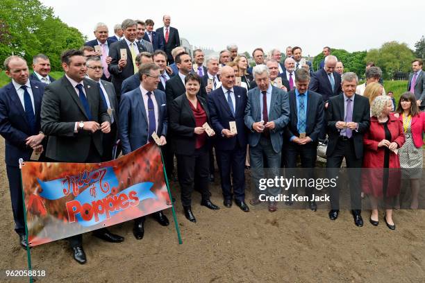 Scottish Conservative leader Ruth Davidson and MSPs from across the party divide prepare to sprinkle poppy seeds in a new Garden of Remembrance in...
