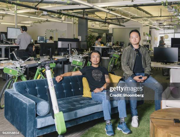 Toby Sun, co-founder and chief executive officer of LimeBike, right, and Brad Bao, co-founder of LimeBike, sit for a photograph at the company's...