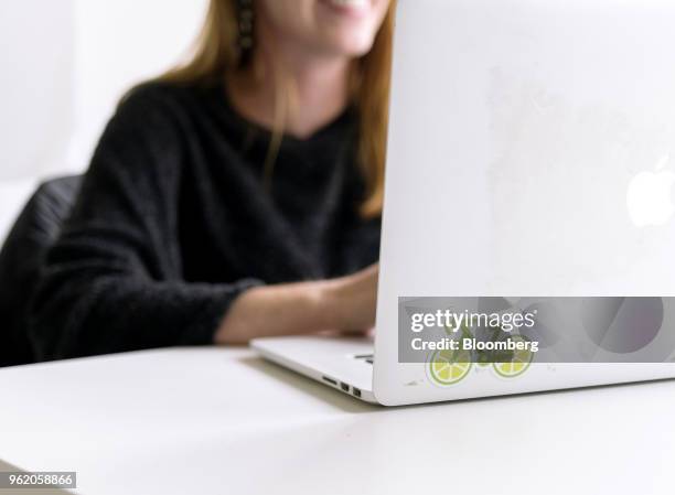 An employee works on a laptop computer at LimeBike headquarters in San Mateo, California, U.S., on Tuesday, May 22, 2018. Neutron Holdings Inc....