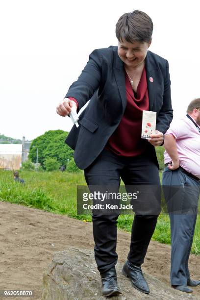 Scottish Conservative leader Ruth Davidson sprinkles poppy seeds in a new Garden of Remembrance in the Parliament grounds as part of the nationwide...