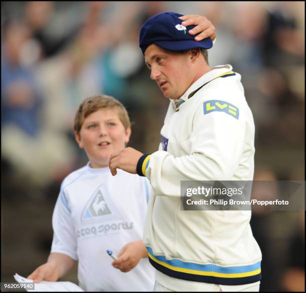 Darren Gough of Yorkshire leaves the field as a young fan hopes for an autograph during the LV County Championship match between Yorkshire and Kent...