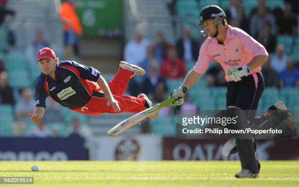 Lou Vincent of Lancashire shies at the stumps as Ed Joyce of Middlesex takes a run during the Twenty20 Cup Quarter Final between Middlesex and...