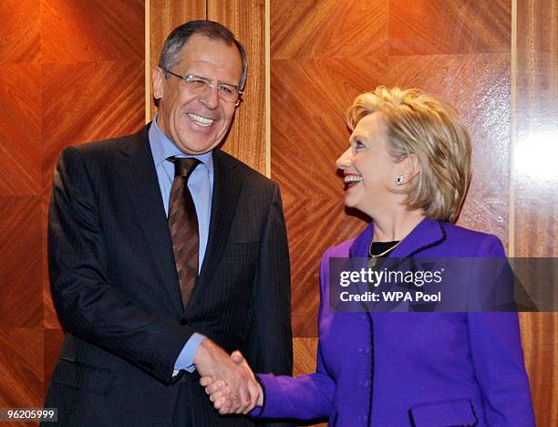 Secretary of State Hillary Clinton and Russian Foreign Minister Sergey Lavrov pose as they arrive for The Afghanistan Conference, on January 27, 2010...