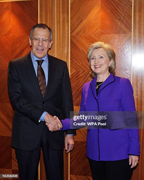 Secretary of State Hillary Clinton and Russian Foreign Minister Sergey Lavrov pose as they arrive for The Afghanistan Conference, on January 27, 2010...