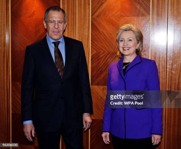 Secretary of State Hillary Clinton and Russian Foreign Minister Sergey Lavrov pose as they arrive for The Afghanistan Conference, on January 27, 2010...
