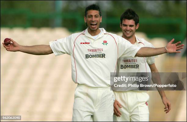 Sajid Mahmood and James Anderson of Lancashire celebrate after taking a wicket during the LV County Championship match between Lancashire and Durham...
