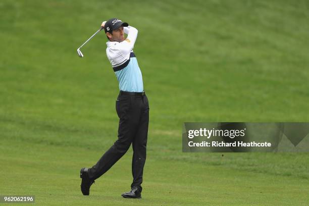 Gregory Bourdy of France hits his second shot on the 4th hole during the first round of the BMW PGA Championship at Wentworth on May 24, 2018 in...