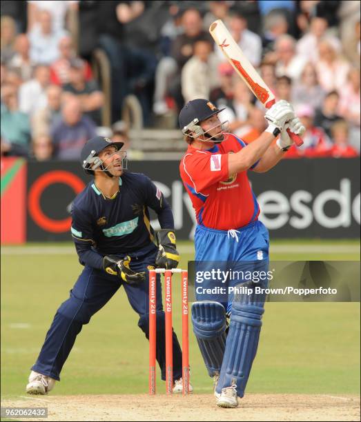 Graham Napier of Essex hits a six watched by Hampshire wicketkeeper Nic Pothas during the Twenty20 Cup match between Essex and Hampshire at...