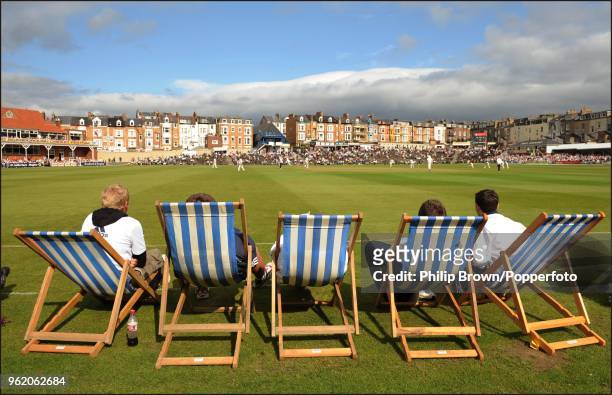 Spectators watch from deckchairs on the boundary during the LV County Championship match between Yorkshire and Kent at North Marine Road,...