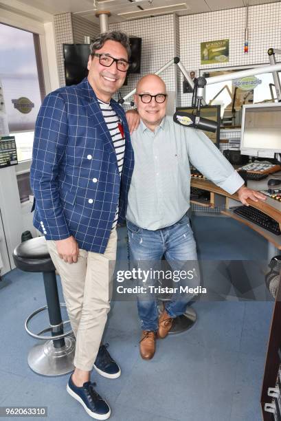 Mousse T. Visits the Spree Radio with presenter Thomas Koschwitz on May 24, 2018 in Berlin, Germany.