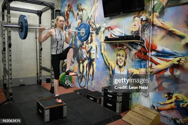 Athlete Camellia Hayes lifts weights in the gym at the British Athletics National Performance Institute on May 24, 2018 in Loughborough, England. The...