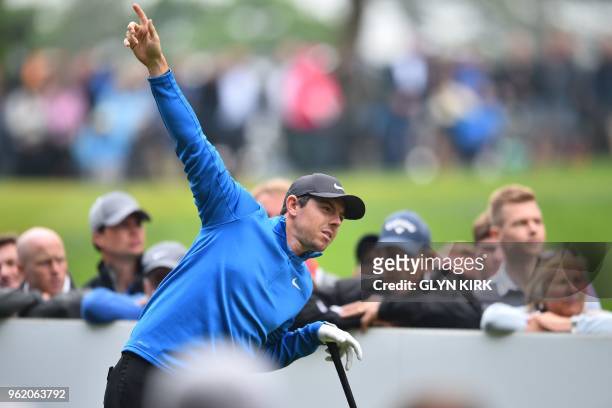 Northern Ireland's Rory McIlroy indicates a wayward drive on the 3rd tee on the first day of the PGA Championship at Wentworth Golf Club in Surrey,...