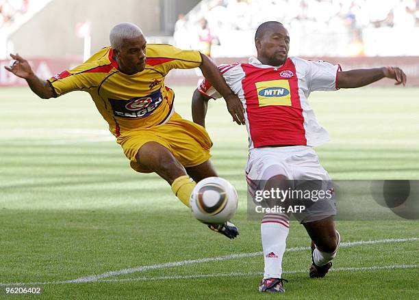 Erwin Isaacs from Santos vies with Nhlanhla Shabalala from Ajax during the Festival of Soccer match between Ajax Cape Town and Santos in the new...