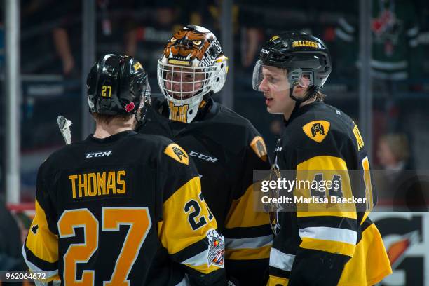 Robert Thomas, Kaden Fulcher and MacKenzie Entwistle of Hamilton Bulldogs celebrate the win against the Acadie-Bathurst Titan at Brandt Centre -...