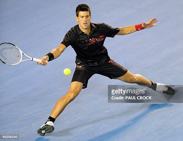 Novak Djokovic of Serbia hits a return during his loss to Jo-Wilfried Tsonga of France in their men's singles quarter-final match on day 10 of the...
