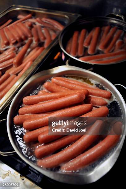 pots of hot dogs boiling on huge stove - vienna sausage stock pictures, royalty-free photos & images