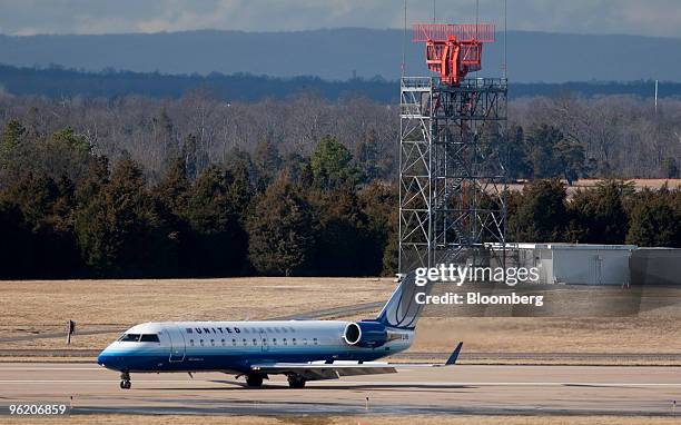 United Express jet taxies on the tarmac at Washington Dulles International Airport in Chantilly, Virginia, U.S., on Monday, Jan. 25, 2010. United...