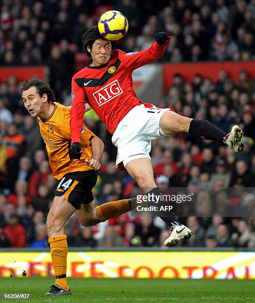 Hull City's Australian midfielder Richard Garcia vies with Manchester United's South Korean midfielder Park Ji-Sung during the English Premier League...