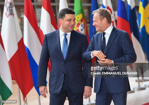 Ukrainian Prime Minister Volodymyr Groysman is welcomed by European Council President Donald Tusk at the European Council in Brussels on May 24, 2018.