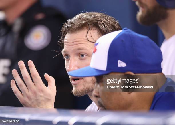 Josh Donaldson of the Toronto Blue Jays talks to bench coach DeMarlo Hale in the dugout during MLB game action against the Los Angeles Angels of...