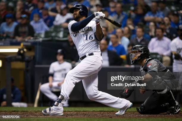 Domingo Santana of the Milwaukee Brewers hits a sacrifice fly in the sixth inning against the Arizona Diamondbacks at Miller Park on May 22, 2018 in...