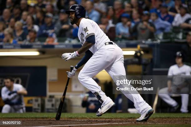Domingo Santana of the Milwaukee Brewers hits a sacrifice fly in the sixth inning against the Arizona Diamondbacks at Miller Park on May 22, 2018 in...