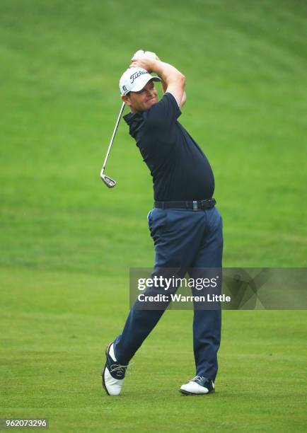 David Drysdale of Scotland plays his second shot on the 4th hole during day one of the BMW PGA Championship at Wentworth on May 24, 2018 in Virginia...