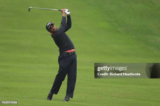 Chawrasia of India hits his second shot on the 4th hole during the first round of the BMW PGA Championship at Wentworth on May 24, 2018 in Virginia...