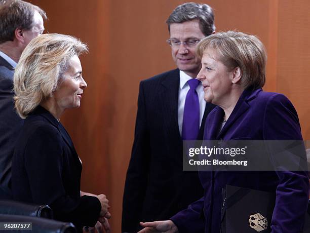 Ursula von der Leyen, Germany's labor minister, left, speaks with Angela Merkel, Germany's chancellor, right, and Guido Westerwelle, Germany's...