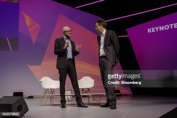 Satya Nadella, chief executive officer of Microsoft Corp., left, speaks with Arthur Sadoun, chief executive officer of Publicis Groupe SA, speaks...