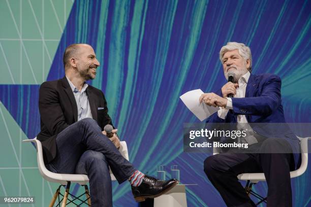 Dara Khosrowshahi, chief executive officer of Uber Technologies Inc., left, reacts beside Maurice Levy, chairman of Publicis Group SA, during the...