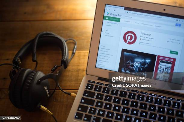 The Pinterest application seen displayed on a Apple MacBook Air computer monitor via the Google Play Store.