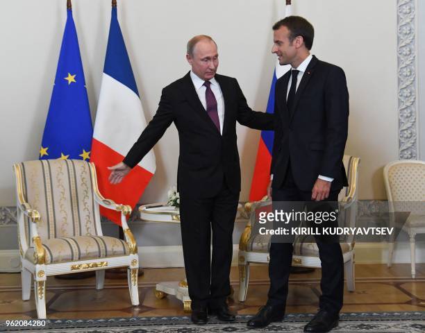 Russian President Vladimir Putin meets with his French counterpart Emmanuel Macron at the Konstantin Palace in Strelna, outside Saint Petersburg, on...