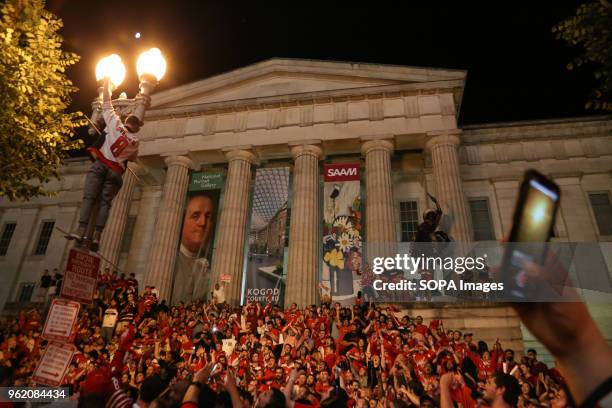 Capitals fans celebrate on the steps of the National portrait gallery after wining game 7 for the Eastern Cup against the Tampa Bay lightning.