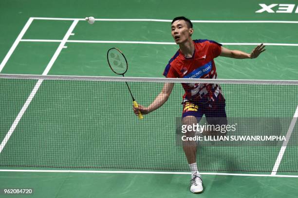 Lee Chong Wei of Malaysia hits a return against Anthony Sinisuka Ginting of Indonesia during their men's singles quarterfinals match at the Thomas...