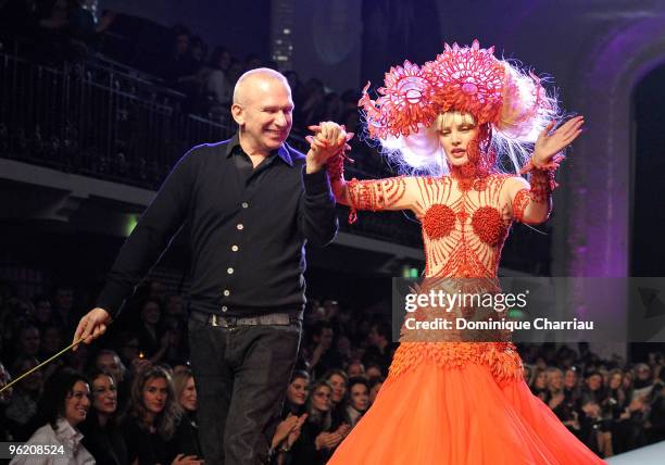 Singer Arielle Dombasle and Designer Jean-Paul Gaultier greet the audience during the Jean-Paul Gaultier Haute Couture fashion show as part of the...