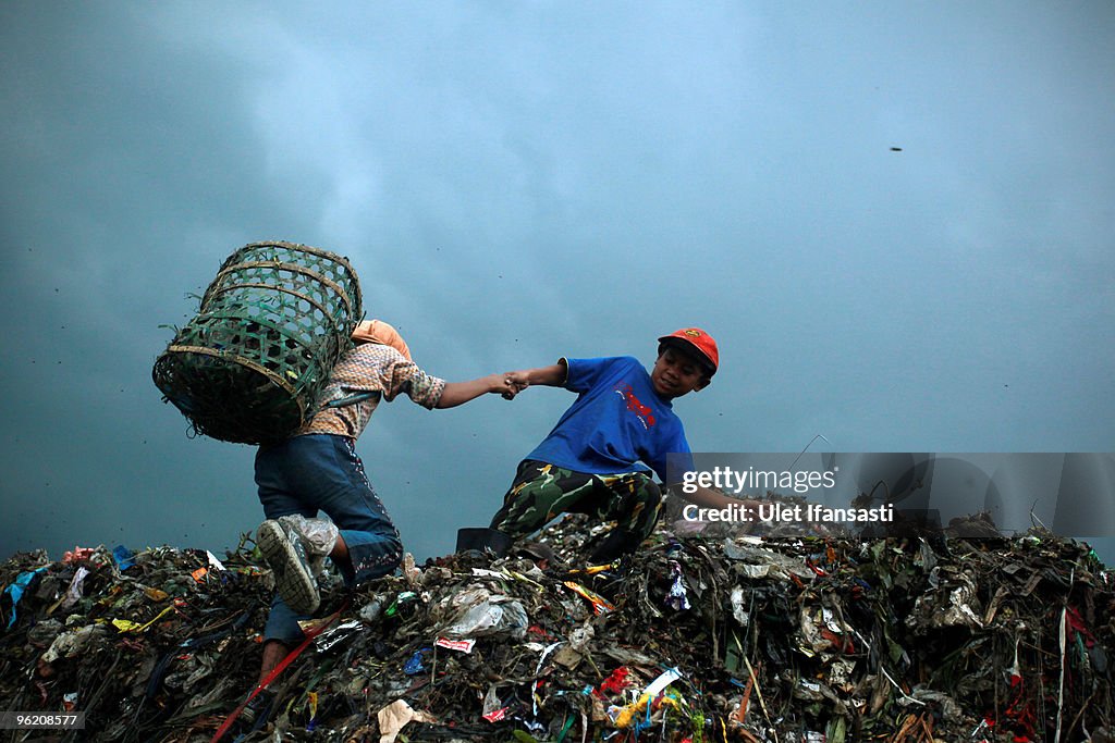 Children Juggle Scavenging With School At Jakarta Landfill Site