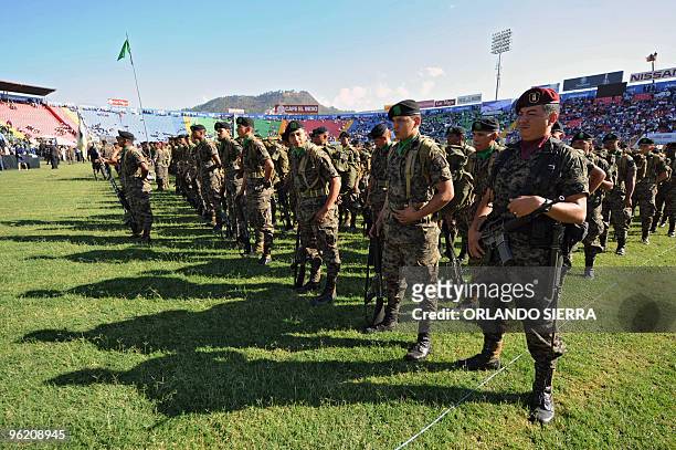 Soldiers attend the inauguration of Honduran President-elect Porfirio Lobo at the Tiburcio Carias Andino stadium in tegucigalpa on January 27, 2010....