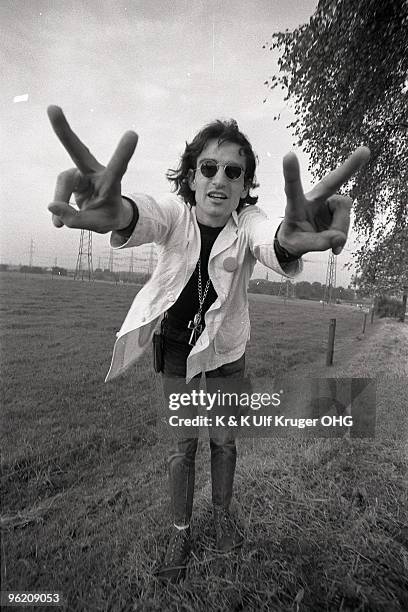David Peel poses for a portrait, doing peace sign hand genstures, in September 1968 in Germany.